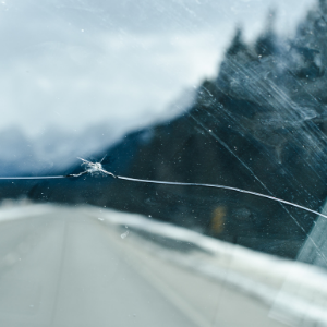 crack in car windshield on the road